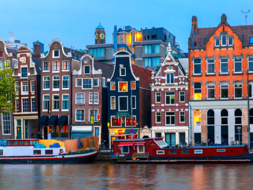 Night city view of Amsterdam canal with dutch houses