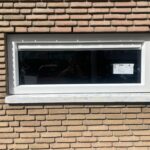 White window on brick wall